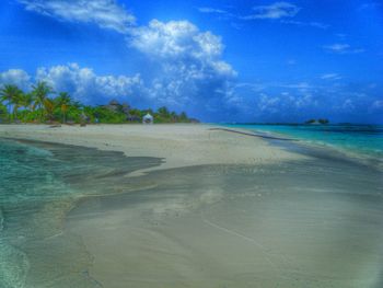 Scenic view of sea against cloudy sky