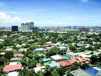 High angle view of buildings in city against sky