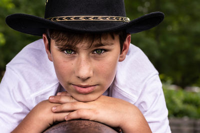 Close-up portrait of boy wearing hat