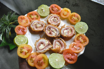 High angle view of fruits in plate on table