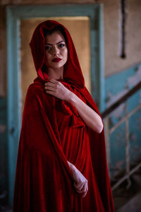 Portrait of beautiful young woman standing outdoors
