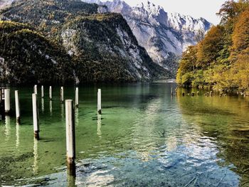 Scenic view of lake by trees against mountain