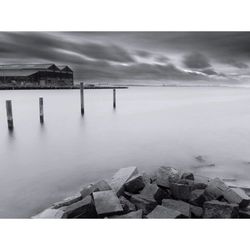 Scenic view of sea against cloudy sky
