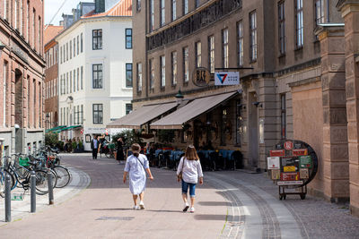 People walking on street in city