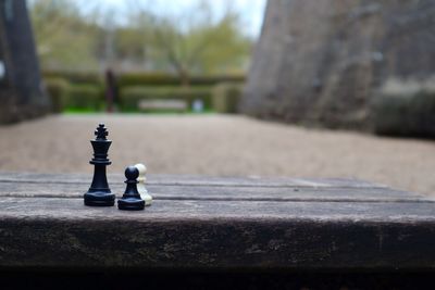 Close-up of chess pieces on table