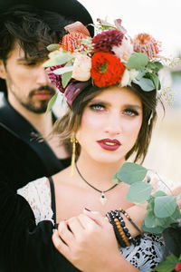 Portrait of young woman with bouquet