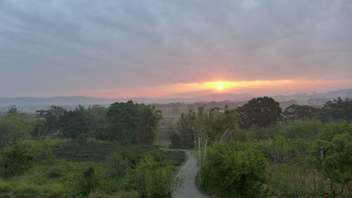 Scenic view of landscape against sky during sunset