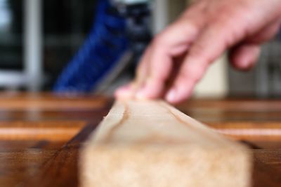 Close-up of person preparing food on table