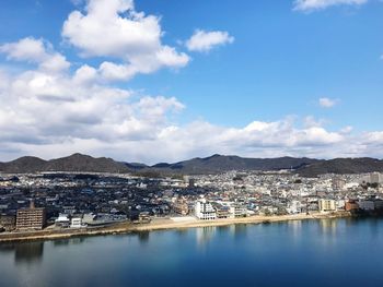 Scenic view of town against sky