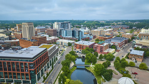 High angle view of buildings in city against sky