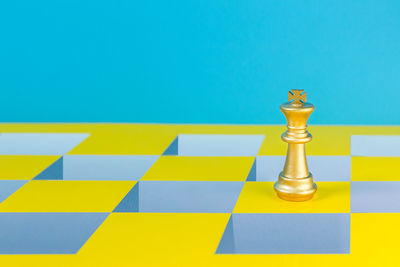 Close-up of chess against blue background