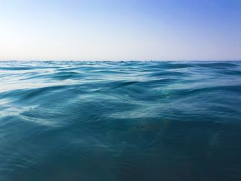 Scenic view of sea against clear blue sky