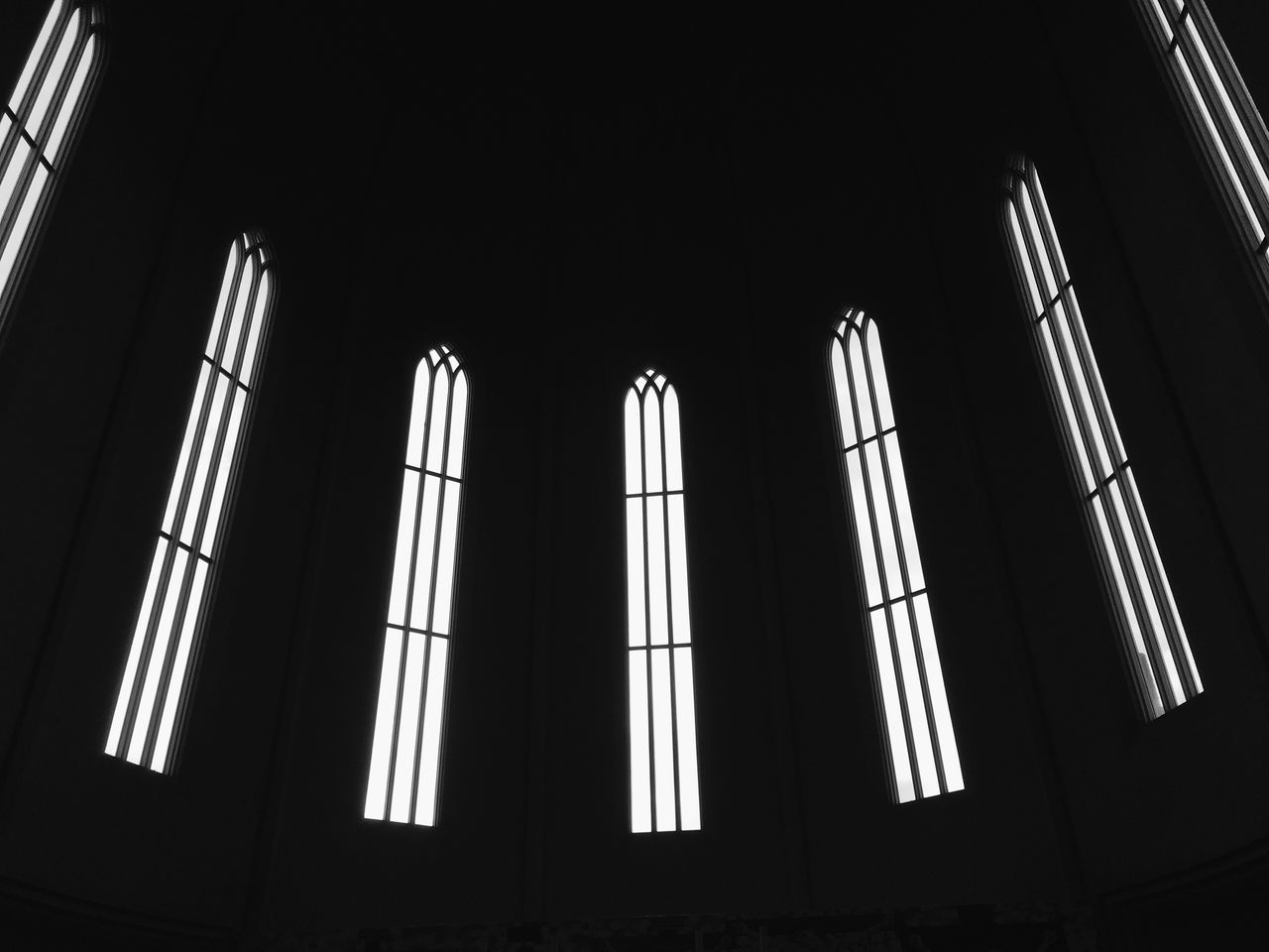 architecture, low angle view, built structure, building exterior, window, building, illuminated, night, no people, modern, indoors, glass - material, repetition, city, office building, pattern, tall - high, dark, architectural feature