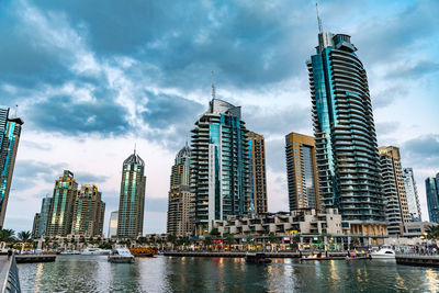 Modern buildings in city against sky