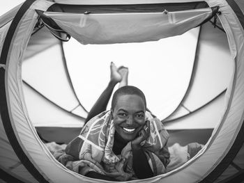 Portrait of smiling woman in tent