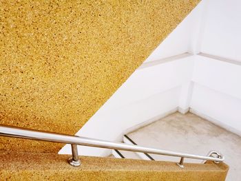 High angle view of tiled floor against wall