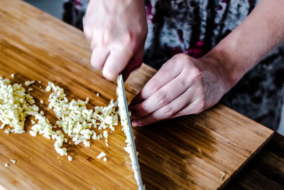 Close-up of hands on table