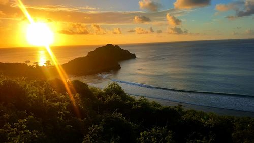 Scenic view of sea against sky at sunset