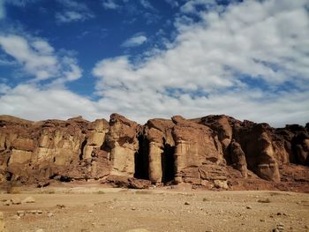 Rock formations on landscape against sky