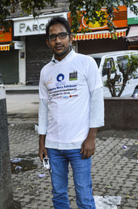 Portrait of young man standing outdoors