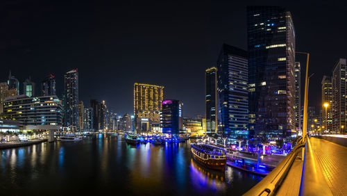 Illuminated buildings in city at night