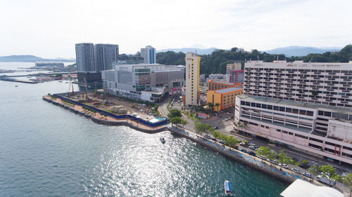 High angle view of river amidst buildings in city