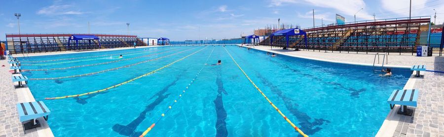 Panoramic view of swimming pool against sky