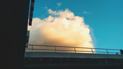 Low angle view of bridge against sky in city