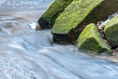 Scenic view of waterfall in sea