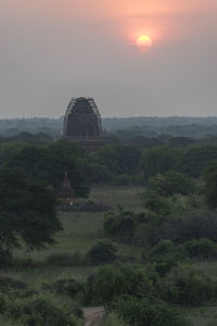 Built structure on field during sunset