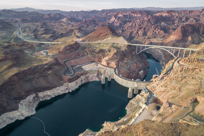 Hoover dam in nevada. mountain and colorado river in background.