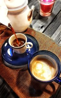 High angle view of coffee cup on table