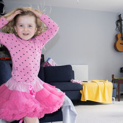 Portrait of girl standing at home