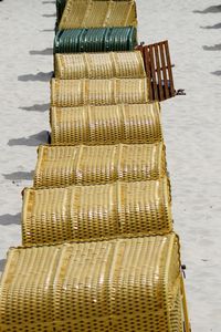 High angle view of hooded beach chairs at beach
