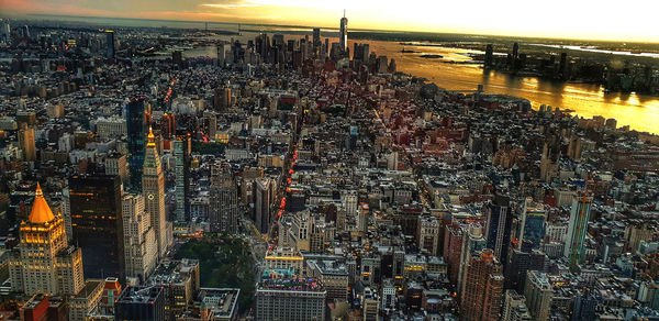 High angle view of city buildings during sunset