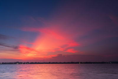 Scenic view of sea against romantic sky at sunset