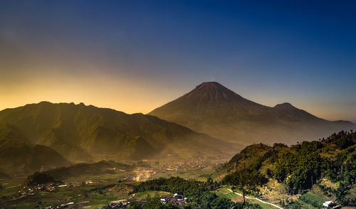 Scenic view of mountains against sky during sunset