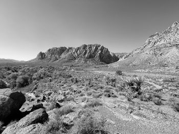 Scenic view of arid landscape against clear sky