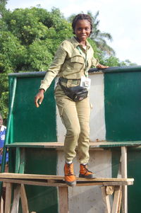 Side view of a young lady carrying out a military training at the parade ground