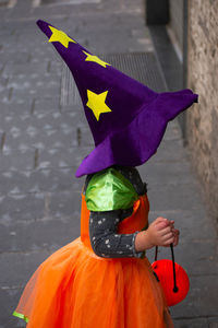 Rear view of woman wearing hat