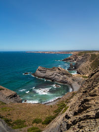 Scenic view of sea against clear blue sky