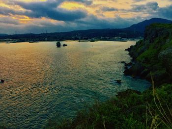 Scenic view of lake against sky during sunset