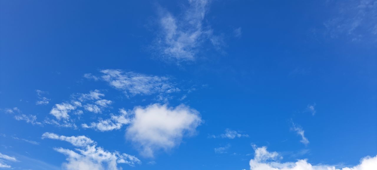 sky, cloud, blue, daytime, nature, environment, cloudscape, backgrounds, white, wind, atmosphere, beauty in nature, clear sky, scenics - nature, panoramic, horizon, no people, outdoors, sunlight, fluffy, copy space, meteorology, idyllic, tranquility, summer, climate, vibrant color, day, low angle view, azure, bright, mid-air, tranquil scene, light - natural phenomenon, space, high up, sparse