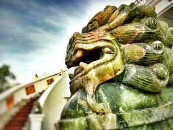 Low angle view of statue against sky