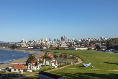 High angle view of townscape against clear blue sky