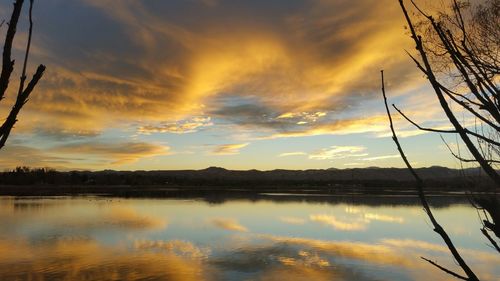 Scenic view of lake at sunset