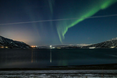 Scenic view of landscape against sky at night