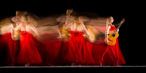 Blurred motion of people dancing in nightclub