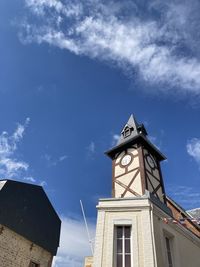 Low angle view of clock tower against sky