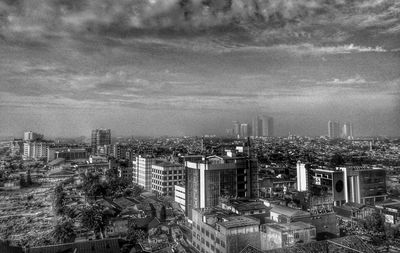 View of city against cloudy sky